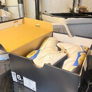 Jordan Retro 6 Sneakers in White, Blue & Gold
